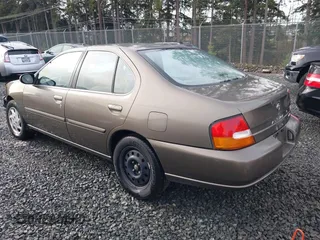 1999 Nissan Altima XE with VIN 1N4DL01D1XC210017, listed as a IAAI auction lot 41199544 with 297,917 mi miles. Bid and sale history available at carsss.com. Image 3.
