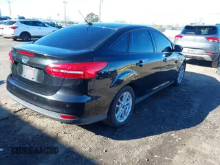 2015 Ford Focus SE with VIN 1FADP3F21FL262033, listed as a IAAI auction lot 41521714 with 101,890 mi miles. Bid and sale history available at carsss.com. Image 4.