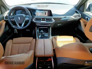 2023 BMW X5 xDrive40i with VIN 5UXCR6C01P9P27041, listed as a Copart auction lot 59009585 with 45,568 mi miles and Salvage title. Bid and sale history available at DreamBid. Image 8.