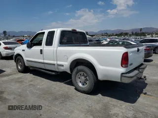 1999 Ford F-250 XL with VIN 1FTNX20L8XEB01923, listed as a Copart auction lot 65404495 with 383,297 mi miles and Salvage title. Bid and sale history available at DreamBid. Image 2.