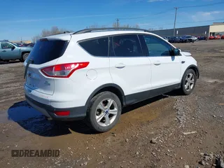 2014 Ford Escape SE with VIN 1FMCU0GX6EUA20379, listed as a IAAI auction lot 42082363 with 129,059 mi miles. Bid and sale history available at carsss.com. Image 4.