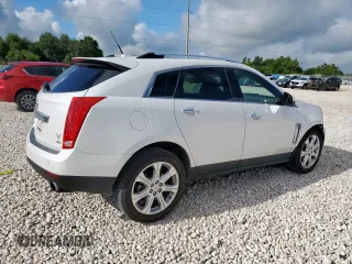 2014 Cadillac SRX Performance Collection with VIN 3GYFNCE39ES687733, listed as a Copart auction lot 62770665 with 151,714 mi miles and Salvage title. Bid and sale history available at DreamBid. Image 3.