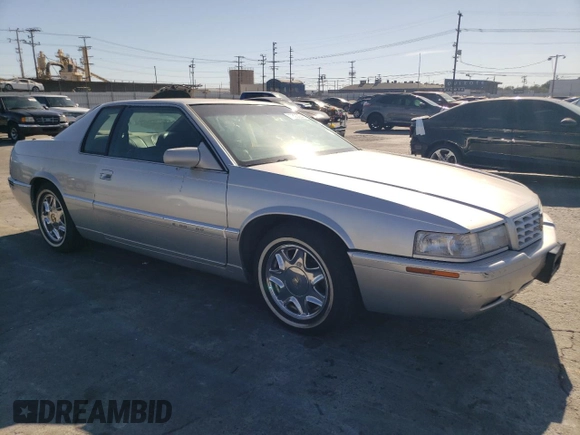 1999 Cadillac Eldorado z VIN 1G6EL12Y0XU604529, wystawiony jako Copart lot #77620004 z przebiegiem 246 032 mil mil oraz Szkoda całkowita • Salvage title. Historia ofert i sprzedaży dostępna na DreamBid. Obrazek 4.