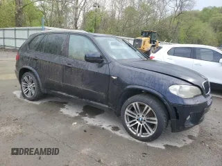 2012 BMW X5 35i z VIN 5UXZV4C5XCL748652, wystawiony jako Copart lot #55457455 z przebiegiem 149 030 mil mil oraz Szkoda całkowita • Salvage title. Historia ofert i sprzedaży dostępna na DreamBid. Obrazek 4.