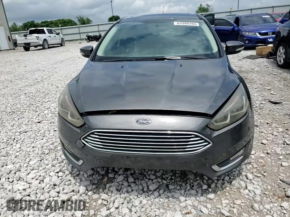 2017 Ford Focus Titanium z VIN 1FADP3N22HL307260, wystawiony jako Copart lot #61399785 z przebiegiem 103 293 mil mil oraz Szkoda całkowita • Salvage title. Historia ofert i sprzedaży dostępna na DreamBid. Obrazek 13.