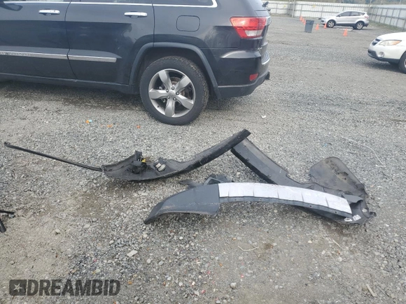 2013 Jeep Grand Cherokee Overland with VIN 1C4RJFCGXDC643802, listed as a Copart auction lot 52429535 with 122,014 mi miles and Salvage Title. Bid and sale history available at carsss.com. Image 15.