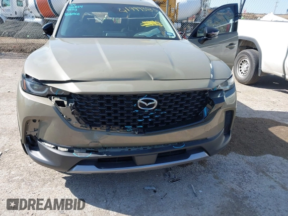2024 Mazda CX-50 Premium z VIN 7MMVABDYXRN229669, wystawiony jako IAAI lot #41999385 z przebiegiem 10 882 mil mil oraz . Historia ofert i sprzedaży dostępna na DreamBid. Obrazek 6.