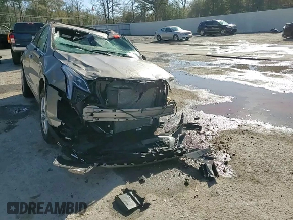 2022 Cadillac XT5 FWD Premium Luxury z VIN 1GYKNCRS8NZ112882, wystawiony jako Copart lot #86999544 z przebiegiem Nie podano mil oraz Szkoda całkowita • Salvage title. Historia ofert i sprzedaży dostępna na DreamBid. Obrazek 11.