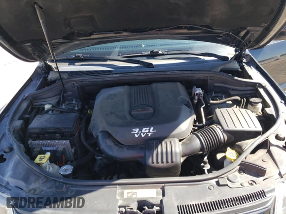 2014 Jeep Grand Cherokee Laredo with VIN 1C4RJEAGXEC217249, listed as a Copart auction lot 48585195 with 131,635 mi miles and Salvage Title. Bid and sale history available at DreamBid. Image 12.