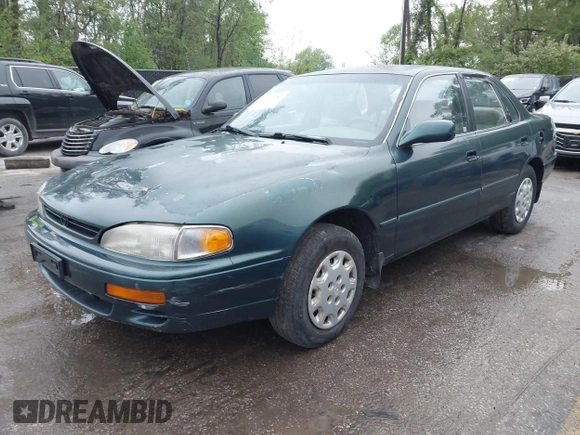1996 Toyota Camry DX with VIN JT2BG12K5T0346311, listed as a IAAI auction lot 42130482 with 214,872 mi miles. Bid and sale history available at carsss.com. Image 2.
