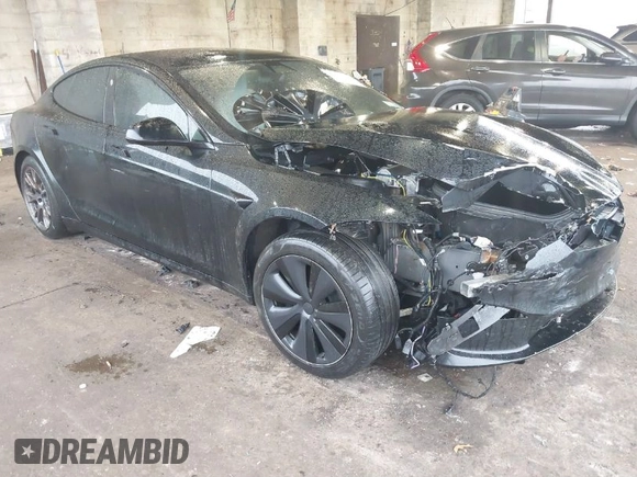 2022 Tesla Model S Plaid with VIN 5YJSA1E64NF477855, listed as a IAAI auction lot 41470591 with Not provided miles and . Bid and sale history available at DreamBid. Image 1.