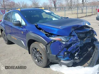 2024 Subaru Crosstrek Wilderness z VIN 4S4GUHT64R3741311, wystawiony jako IAAI lot #41826276 z przebiegiem 7807 mil mil oraz . Historia ofert i sprzedaży dostępna na DreamBid. Obrazek 1.