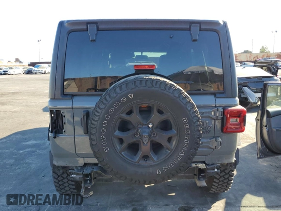 2020 Jeep Wrangler Unlimited Willys with VIN 1C4HJXDG5LW348507, listed as a Copart auction lot 77000574 with 57,056 mi miles and Salvage title. Bid and sale history available at DreamBid. Image 6.