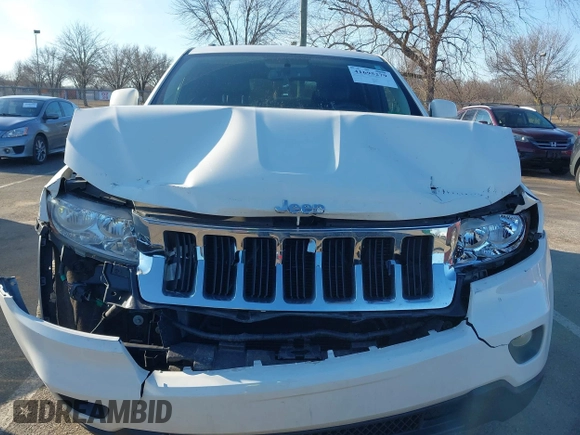 2012 Jeep Grand Cherokee Laredo with VIN 1C4RJFAG5CC310893, listed as a IAAI auction lot 41695279 with 136,821 mi miles. Bid and sale history available at carsss.com. Image 12.