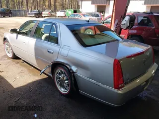 2006 Cadillac DTS w/1SC with VIN 1G6KD57Y46U165978, listed as a IAAI auction lot 41854728 with 116,455 mi miles. Bid and sale history available at carsss.com. Image 3.