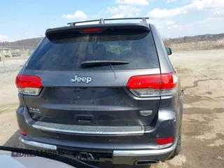2014 Jeep Grand Cherokee Summit with VIN 1C4RJFJM5EC377129, listed as a IAAI auction lot 41763932 with 187,561 mi miles and . Bid and sale history available at DreamBid. Image 16.