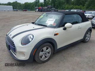 2019 MINI Convertible Cooper z VIN WMWWG5C52K3F79780, wystawiony jako IAAI lot #42622429 z przebiegiem 38 532 mil mil oraz . Historia ofert i sprzedaży dostępna na DreamBid. Obrazek 19.