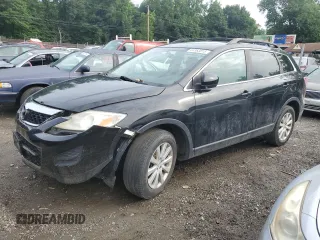 2010 Mazda CX-9 Grand Touring with VIN JM3TB3MV6A0214594, listed as a Copart auction lot 64363815 with 208,699 mi miles and Salvage title. Bid and sale history available at DreamBid. Image 1.