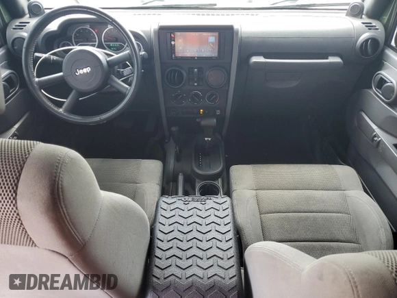 2007 Jeep Wrangler Unlimited Sahara с VIN 1J4GA59167L107870, выставлен на аукционе Copart как лот 58346115 с пробегом 180 107 миль миль и Чистый • Clean title. История ставок и продаж доступна на DreamBid. Изображение 8.