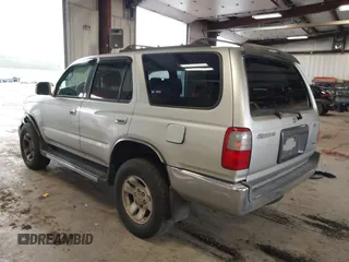 1999 Toyota 4Runner SR5 z VIN JT3HN86R8X0221532, wystawiony jako IAAI lot #41902556 z przebiegiem 406 602 mil mil oraz . Historia ofert i sprzedaży dostępna na DreamBid. Obrazek 3.