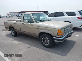 1989 Ford Ranger XL z VIN 1FTCR10A6KUC58357, wystawiony jako IAAI lot #42421511 z przebiegiem 94 599 mil mil oraz . Historia ofert i sprzedaży dostępna na DreamBid. Obrazek 1.