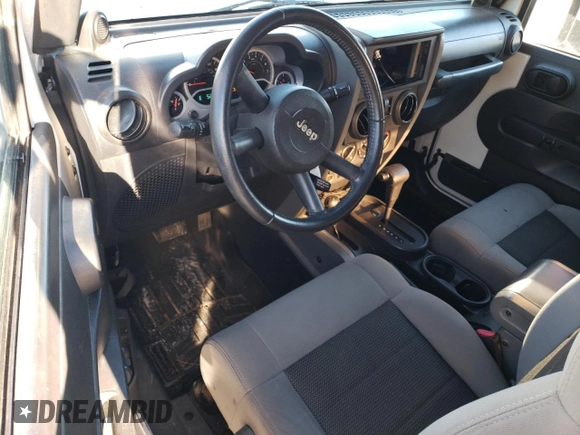 2010 Jeep Wrangler Rubicon with VIN 1J4BA6D17AL132002, listed as a Copart auction lot 83869124 with 183,507 mi miles and Salvage title. Bid and sale history available at DreamBid. Image 8.