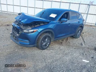 2020 Mazda CX-5 Touring with VIN JM3KFACM0L0775020, listed as a IAAI auction lot 40876970 with 96,424 mi miles. Bid and sale history available at carsss.com. Image 16.