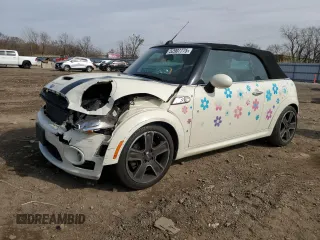 2010 MINI Convertible S with VIN WMWMS3C51ATZ85166, listed as a Copart auction lot 52907775 with 90,090 mi miles and Salvage title. Bid and sale history available at DreamBid. Image 1.