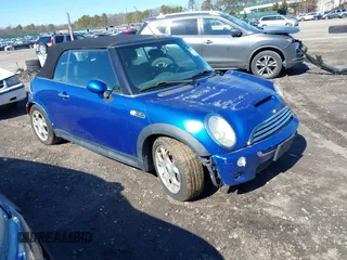 2006 MINI Convertible S with VIN WMWRH33506TK59570, listed as a IAAI auction lot 41598815 with 196,673 mi miles and . Bid and sale history available at DreamBid. Image 1.