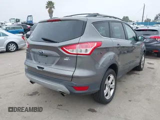 2014 Ford Escape SE with VIN 1FMCU9GX7EUC04296, listed as a IAAI auction lot 42159486 with 108,598 mi miles and . Bid and sale history available at DreamBid. Image 4.