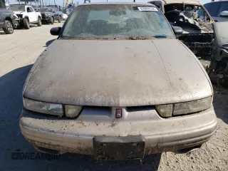 1997 Oldsmobile Cutlass Supreme S z VIN 1G3WH52M1VF353626, wystawiony jako Copart lot #63069534 z przebiegiem 62 841 mil mil oraz Szkody całkowita. Historia ofert i sprzedaży dostępna na DreamBid. Obrazek 5.