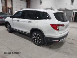 2022 Honda Pilot Touring 7-Passenger with VIN 5FNYF6H63NB063857, listed as a IAAI auction lot 41936941 with 54,424 mi miles. Bid and sale history available at carsss.com. Image 3.