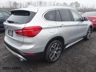2021 BMW X1 xDrive28i with VIN WBXJG9C04M5T79810, listed as a IAAI auction lot 41471536 with 75,345 mi miles. Bid and sale history available at carsss.com. Image 4.