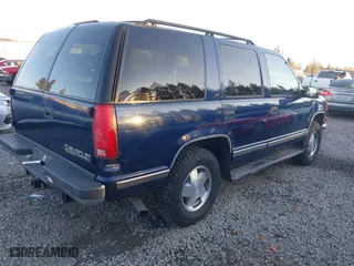 1997 Chevrolet Tahoe with VIN 1GNEK13R4VJ418974, listed as a IAAI auction lot 41560411 with 198,170 mi miles. Bid and sale history available at carsss.com. Image 4.