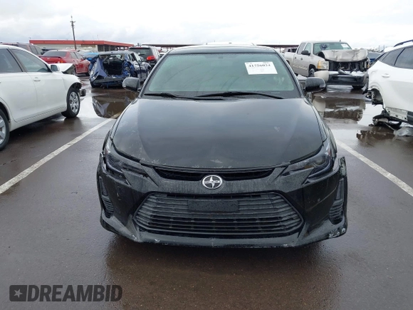 2015 Scion tC with VIN JTKJF5C79FJ003404, listed as a IAAI auction lot 41756024 with 128,906 mi miles. Bid and sale history available at carsss.com. Image 12.
