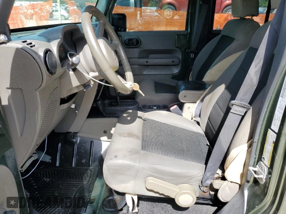 2008 Jeep Wrangler Unlimited X with VIN 1J4GA39118L633877, listed as a Copart auction lot 63652795 with 129,856 mi miles and Clean title. Bid and sale history available at DreamBid. Image 7.