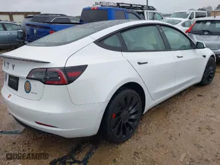 2021 Tesla Model 3 Performance with VIN 5YJ3E1EC3MF995632, listed as a IAAI auction lot 41548478 with 43,585 mi miles. Bid and sale history available at carsss.com. Image 4.
