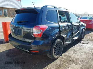 2015 Subaru Forester 2.0XT Premium with VIN JF2SJGDC2FH532994, listed as a IAAI auction lot 41797117 with 104,571 mi miles. Bid and sale history available at carsss.com. Image 4.