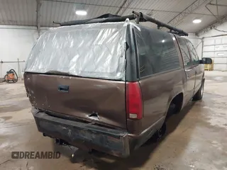1994 GMC Suburban with VIN 1GKEC16K1RJ738915, listed as a IAAI auction lot 41717424 with 173,338 mi miles. Bid and sale history available at carsss.com. Image 4.