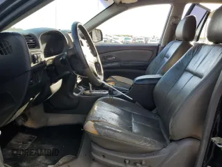 2002 Isuzu Axiom with VIN 4S2CE58XX24612512, listed as a Copart auction lot 77952574 with 201,436 mi miles and Salvage Title. Bid and sale history available at carsss.com. Image 7.