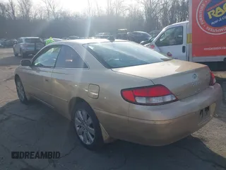2000 Toyota Solara SE with VIN 2T1CG22P7YC303938, listed as a IAAI auction lot 41770102 with 163,137 mi miles. Bid and sale history available at carsss.com. Image 3.