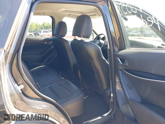 2013 Mazda CX-5 Grand Touring with VIN JM3KE4DE6D0127601, listed as a IAAI auction lot 42143558 with 95,719 mi miles and . Bid and sale history available at DreamBid. Image 8.