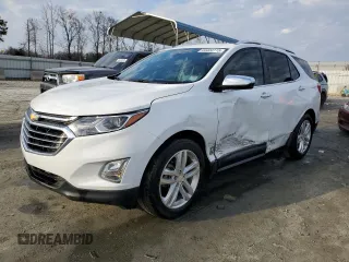 2021 Chevrolet Equinox Premier z VIN 3GNAXNEV7MS182867, wystawiony jako Copart lot #44404115 z przebiegiem 58 583 mil mil oraz Szkoda całkowita • Salvage title. Historia ofert i sprzedaży dostępna na DreamBid. Obrazek 1.