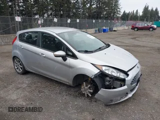 2015 Ford Fiesta SE z VIN 3FADP4EJ7FM205610, wystawiony jako IAAI lot #41832049 z przebiegiem 119 939 mil mil oraz . Historia ofert i sprzedaży dostępna na DreamBid. Obrazek 1.