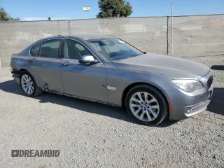 2014 BMW 7 Series 740i with VIN WBAYA6C55ED144487, listed as a Copart auction lot 77044014 with 86,149 mi miles and Salvage Title. Bid and sale history available at carsss.com. Image 4.