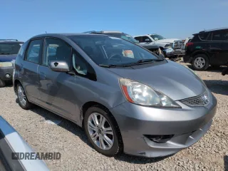 2010 Honda Fit Sport with VIN JHMGE8H41AC002070, listed as a Copart auction lot 62356565 with 148,279 mi miles and Salvage title. Bid and sale history available at DreamBid. Image 4.