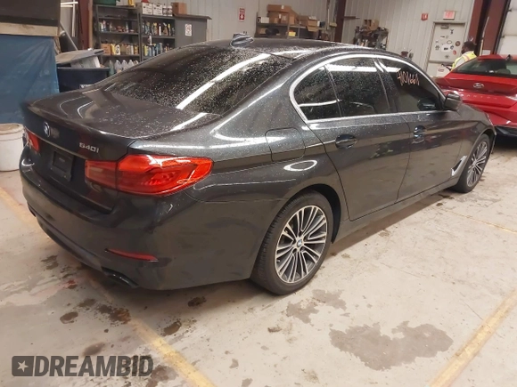 2019 BMW 5 Series 540i xDrive with VIN WBAJE7C53KWW12941, listed as a IAAI auction lot 41016611 with 77,499 mi miles and . Bid and sale history available at DreamBid. Image 4.