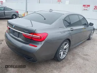 2016 BMW 7 Series 740i with VIN WBA7E2C56GG546920, listed as a IAAI auction lot 41610698 with 119,689 mi miles. Bid and sale history available at carsss.com. Image 4.