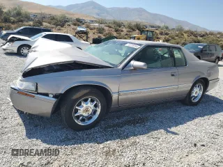 1996 Cadillac Eldorado z VIN 1G6EL12Y3TU618242, wystawiony jako Copart lot #70318844 z przebiegiem Nie podano mil oraz Szkody całkowita. Historia ofert i sprzedaży dostępna na DreamBid. Obrazek 1.