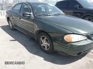 2000 Pontiac Grand Am SE1 with VIN 1G2NF52T0YM808611, listed as a IAAI auction lot 41943125 with 132,887 mi miles. Bid and sale history available at carsss.com. Image 6.